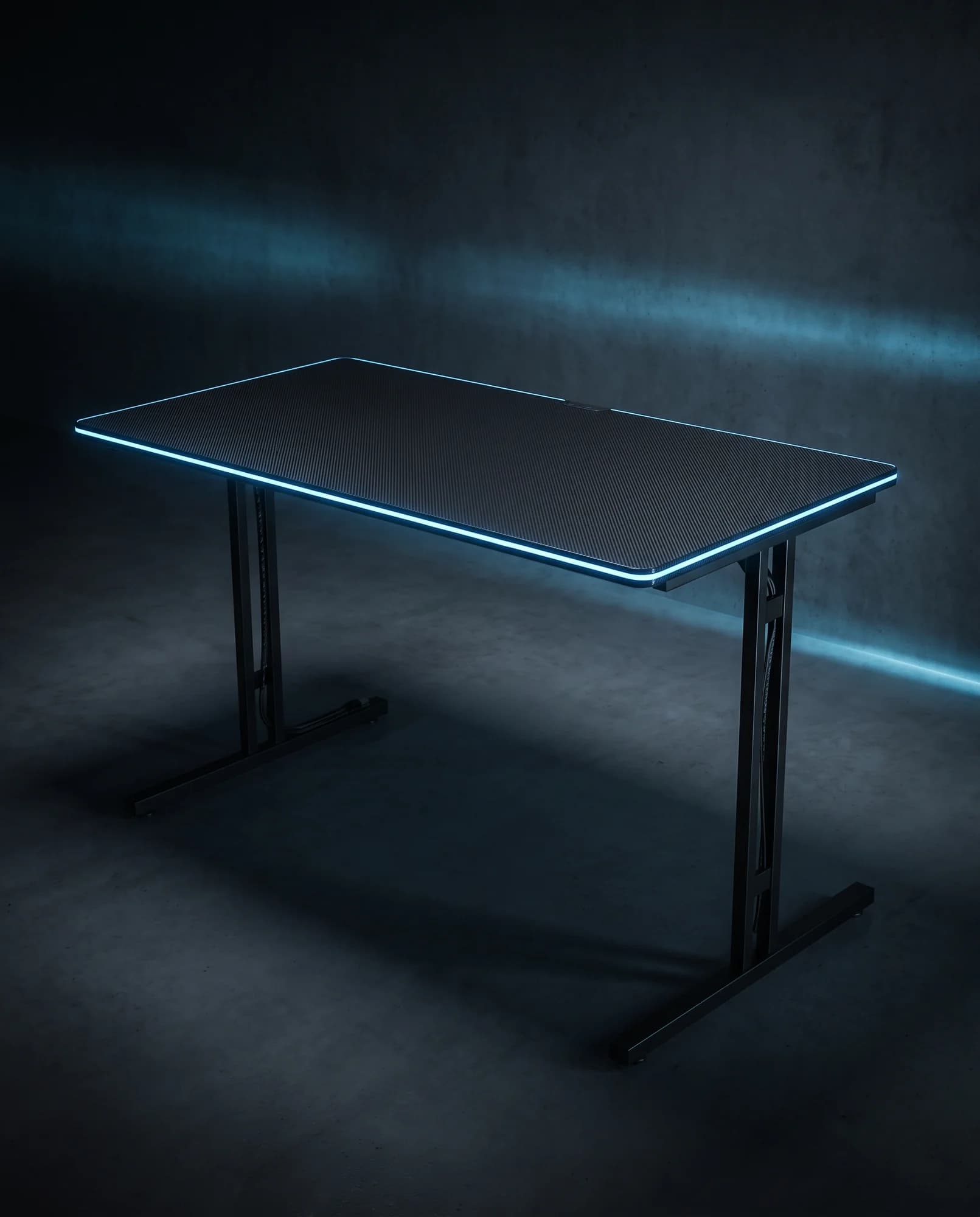 Dark carbon-top gaming desk with LED edge lighting